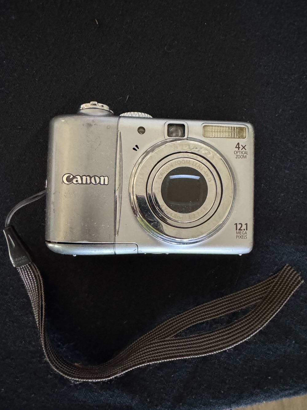 Compact Silver Digital Camera with Wrist Strap